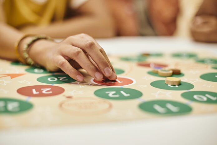 Woman playing board game