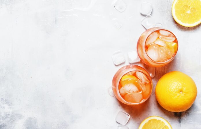 Orange Cocktail With Aperitif, Ice, Sparkling Wine And Orange Slice